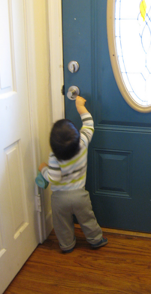 The Pip pulls on the handle of the front door
